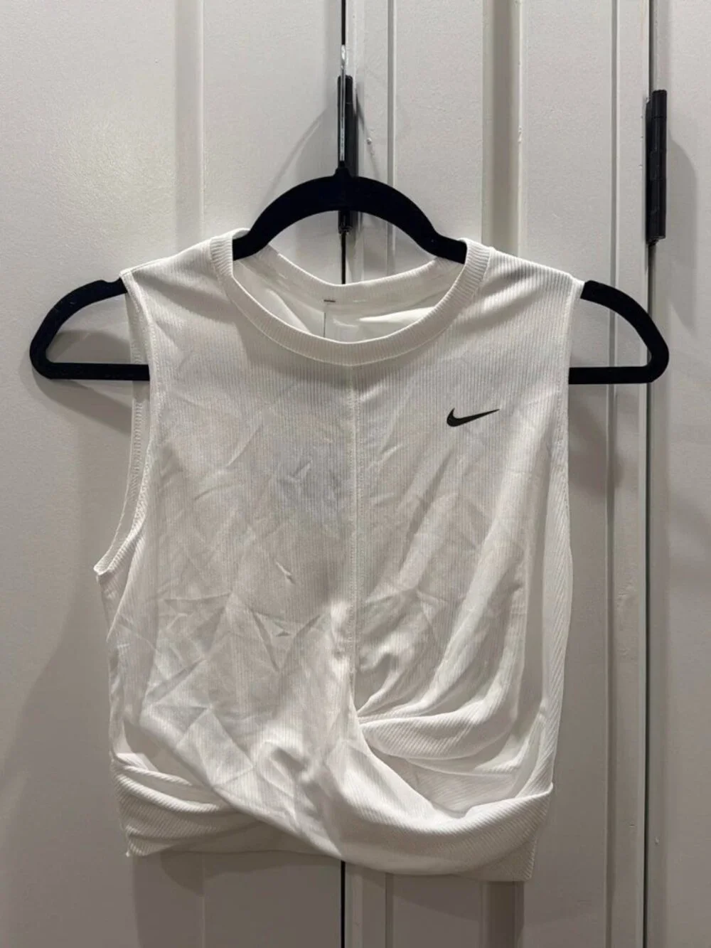 White Nike cinched tank top with black swoosh